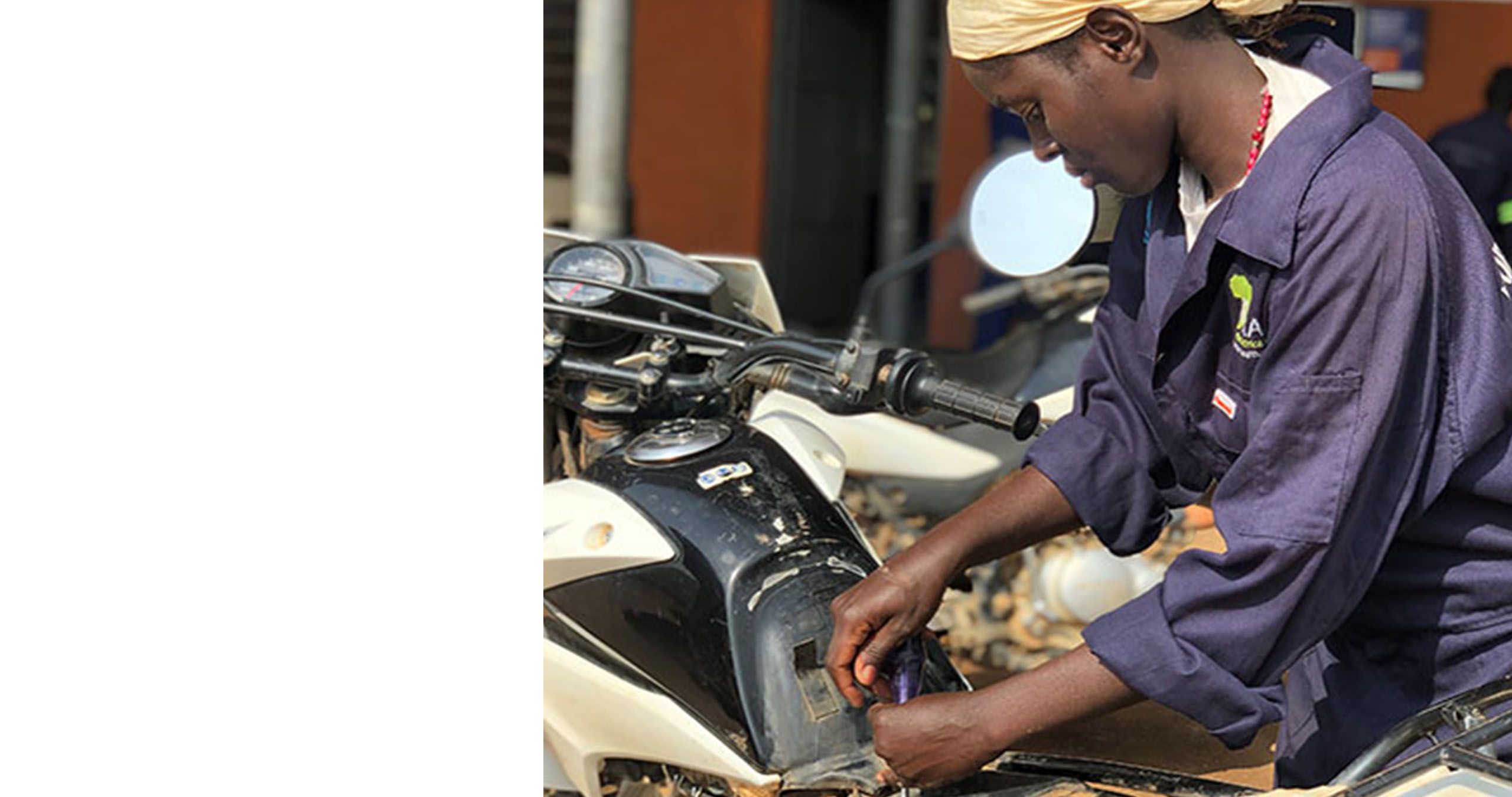 A woman fixes a bike.
