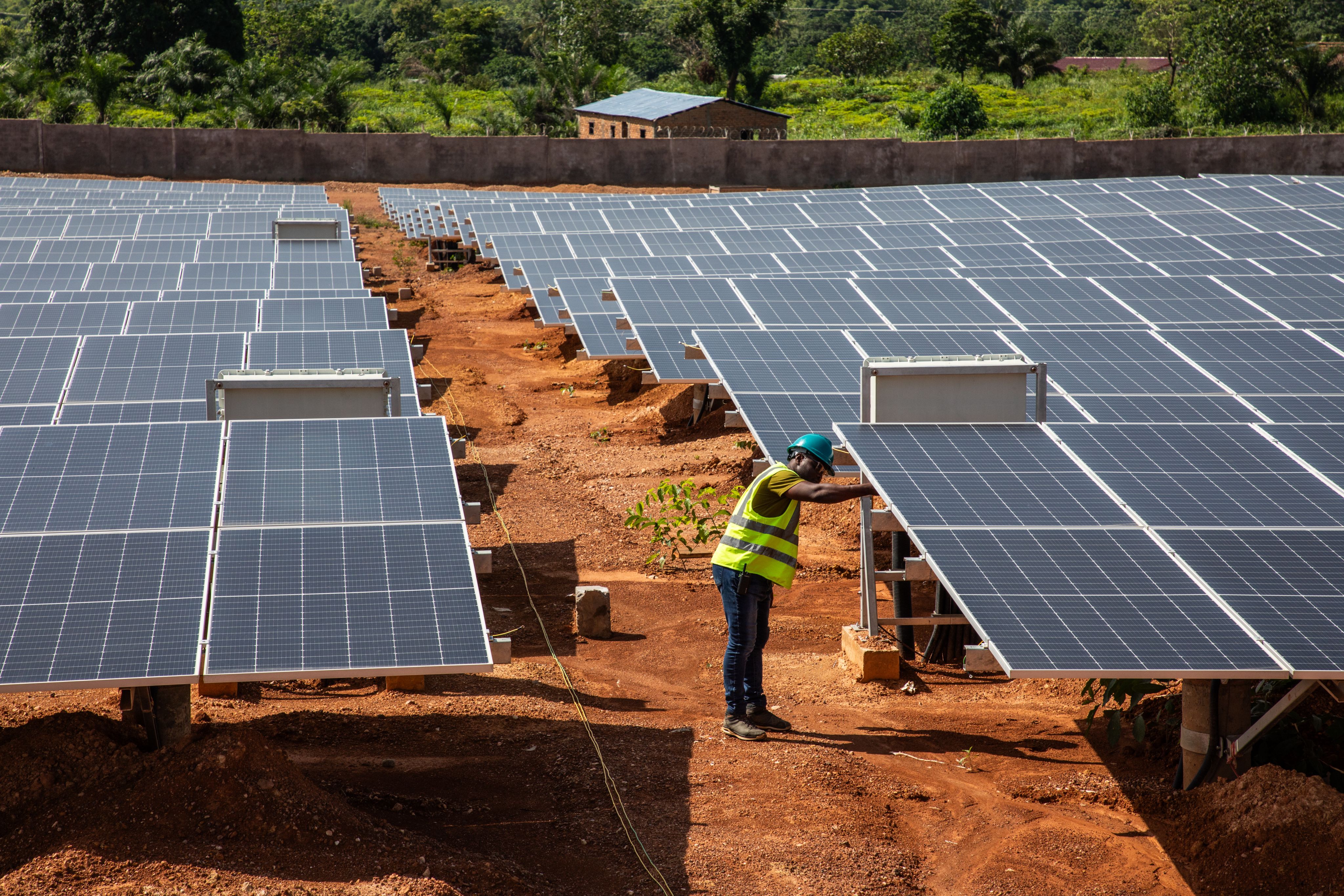 Worker inspects a solar panel at the solar park in Bangui, Central African Republic.